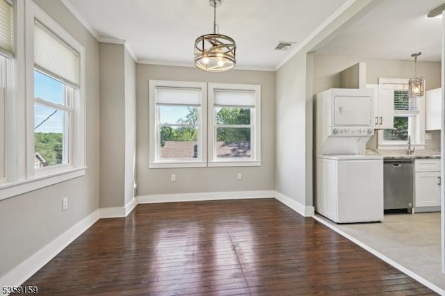 76 Mountainview Ave, Mount Arlington Boro, NJ 07856 - kitchen featuring stacked washer and clothes dryer, a chandelier, dishwasher, healthy amount of natural light, and crown molding