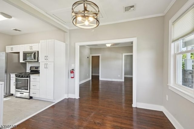 76 Mountainview Ave, Mount Arlington Boro, NJ 07856 - kitchen with stainless steel appliances, wood finished floors, a chandelier, ornamental molding, and white cabinets
