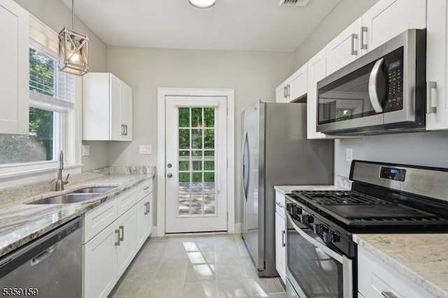 76 Mountainview Ave, Mount Arlington Boro, NJ 07856 - kitchen with appliances with stainless steel finishes, a sink, and white cabinetry
