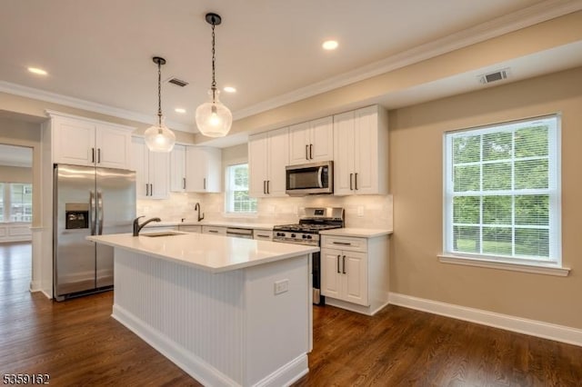 2000 Whittier St, Rahway City, NJ 07065 - kitchen featuring stainless steel appliances, crown molding, decorative backsplash, dark wood-type flooring, and a sink