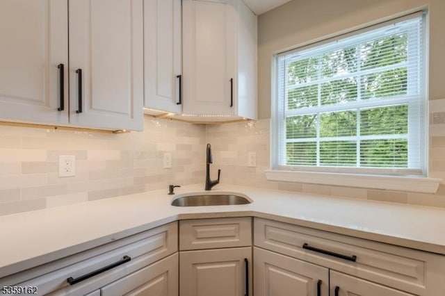 2000 Whittier St, Rahway City, NJ 07065 - kitchen with a sink, light countertops, plenty of natural light, and decorative backsplash