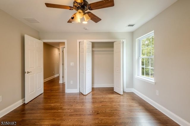 2000 Whittier St, Rahway City, NJ 07065 - unfurnished bedroom with dark wood-type flooring, a closet, baseboards, and a ceiling fan
