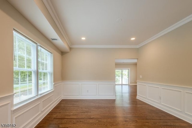 2000 Whittier St, Rahway City, NJ 07065 - spare room featuring a decorative wall, dark wood-type flooring, crown molding, a wainscoted wall, and recessed lighting