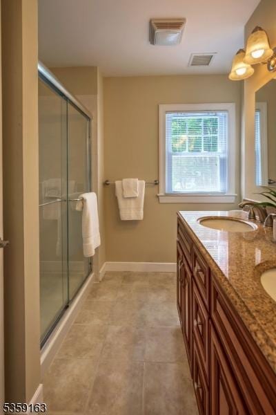 41 Lake Rd, Bernards Twp, NJ 07920 - full bathroom with a stall shower, double vanity, and baseboards