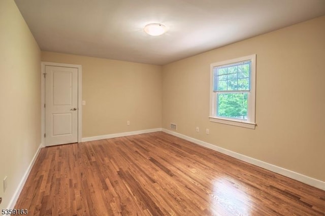 41 Lake Rd, Bernards Twp, NJ 07920 - unfurnished room with wood finished floors and baseboards