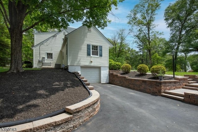 41 Lake Rd, Bernards Twp, NJ 07920 - view of side of property with asphalt driveway and an attached garage