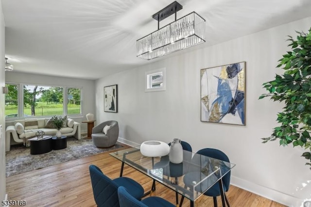 158 Old Indian Rd, West Orange Twp, NJ 07052 - dining space featuring a chandelier, baseboards, and wood finished floors