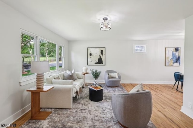 158 Old Indian Rd, West Orange Twp, NJ 07052 - living area with wood finished floors, baseboards, and a chandelier