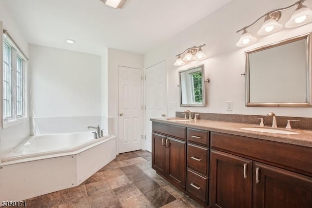 9 Baker Rd, Livingston Twp, NJ 07039 - bathroom with double vanity, plenty of natural light, and a bath