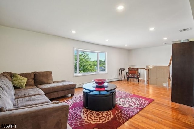 9 Baker Rd, Livingston Twp, NJ 07039 - living area featuring wood finished floors, recessed lighting, and baseboard heating