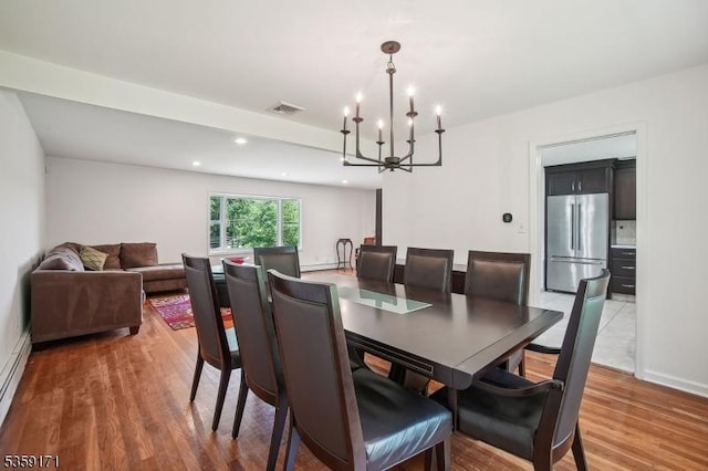 9 Baker Rd, Livingston Twp, NJ 07039 - dining room with a chandelier, wood finished floors, recessed lighting, and baseboards