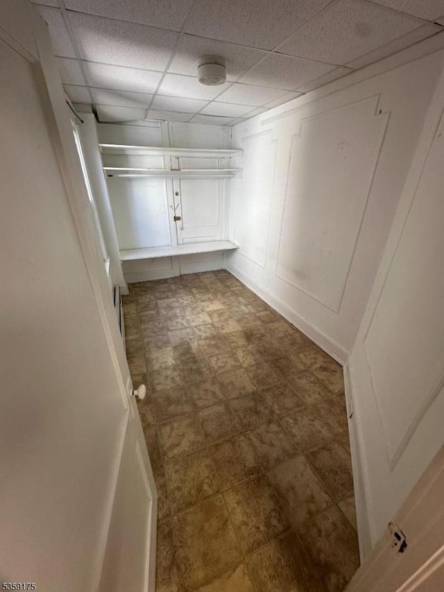 walk in closet featuring a paneled ceiling