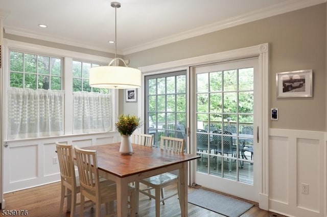 216 Kimball Ave, Westfield Town, NJ 07090 - dining room featuring wood finished floors, ornamental molding, plenty of natural light, and a decorative wall