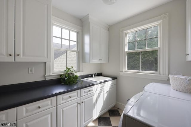 216 Kimball Ave, Westfield Town, NJ 07090 - laundry room featuring cabinet space, washer and dryer, and baseboards