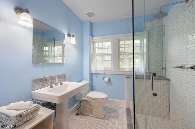 216 Kimball Ave, Westfield Town, NJ 07090 - bathroom with a stall shower, toilet, tile patterned floors, and baseboards