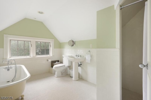 216 Kimball Ave, Westfield Town, NJ 07090 - full bath featuring tile walls, a freestanding tub, a wainscoted wall, a tile shower, and toilet