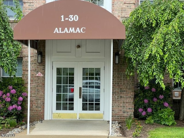 24 Ridgeview Ln Unit 24, Mount Arlington Boro, NJ 07856 - view of exterior entry featuring brick siding and french doors