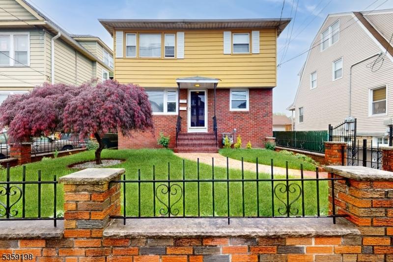 9 Dayton St, Elizabeth City, NJ 07202 - colonial home featuring entry steps and brick siding