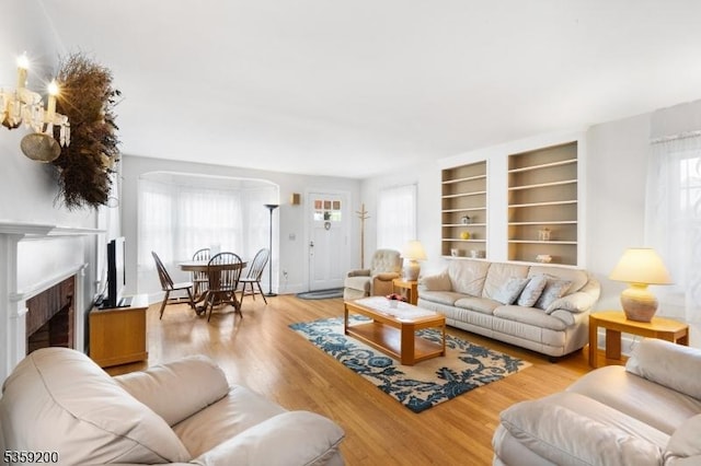 20 Kenvil Ave, Roxbury Twp, NJ 07876 - living area with light wood-style floors, a fireplace, and built in features