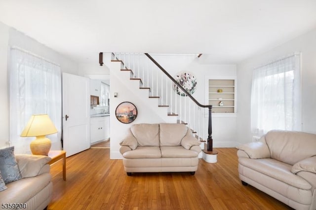 20 Kenvil Ave, Roxbury Twp, NJ 07876 - living area featuring light wood-type flooring, stairs, baseboards, and built in features