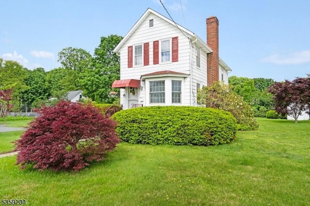 20 Kenvil Ave, Roxbury Twp, NJ 07876 - view of side of property with a chimney and a yard