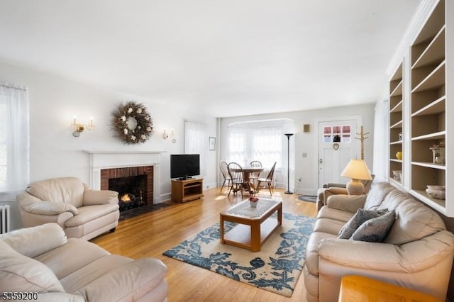 20 Kenvil Ave, Roxbury Twp, NJ 07876 - living room with a brick fireplace and light wood-style flooring