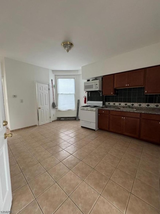 653 4th Ave, Elizabeth City, NJ 07202 - kitchen featuring white appliances, tasteful backsplash, and light tile patterned floors
