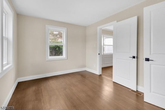 179 Berkeley Ave, Berkeley Heights Twp, NJ 07922 - empty room with plenty of natural light, wood finished floors, and baseboards