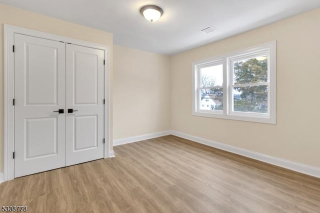 179 Berkeley Ave, Berkeley Heights Twp, NJ 07922 - unfurnished bedroom with baseboards, light wood finished floors, and a closet