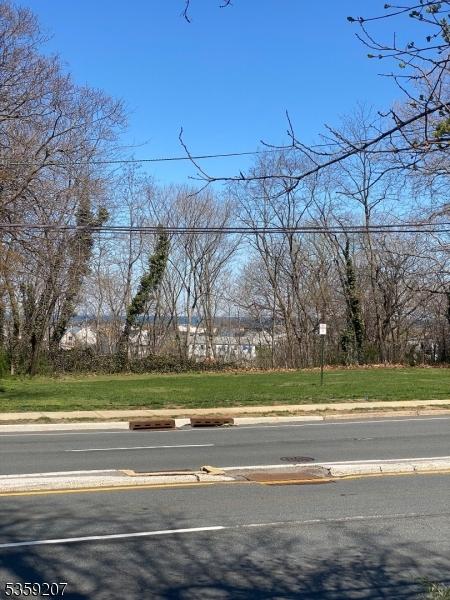 115 Navesink Ave, Highlands Boro, NJ 07732 - view of asphalt road with curbs