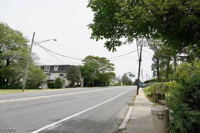 115 Navesink Ave, Highlands Boro, NJ 07732 - view of asphalt street featuring street lights, curbs, and sidewalks