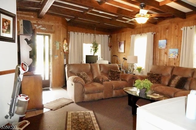 115 Navesink Ave, Highlands Boro, NJ 07732 - carpeted living area with wood walls, beam ceiling, and ceiling fan