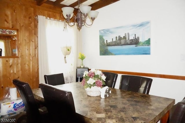 115 Navesink Ave, Highlands Boro, NJ 07732 - dining room with a chandelier, wood walls, and beam ceiling