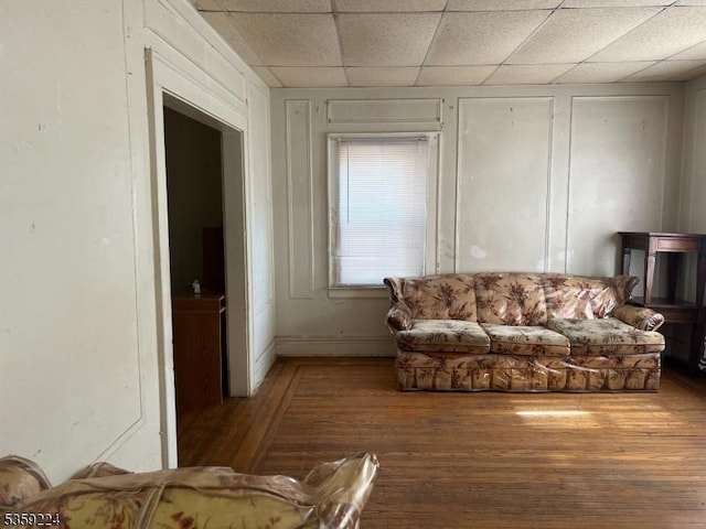 285 N Center St, City Of Orange Twp, NJ 07050 - living room with wood finished floors, a paneled ceiling, and baseboards