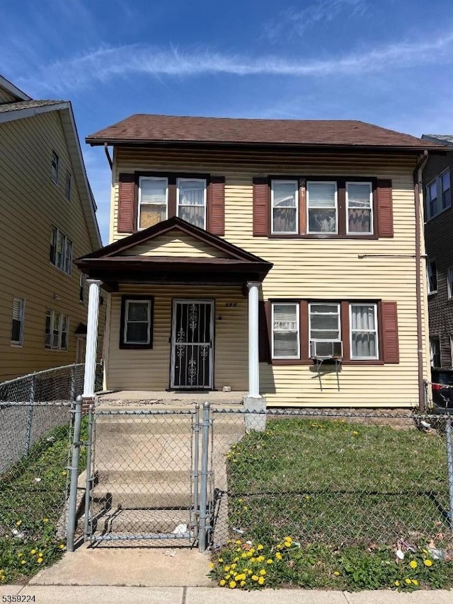 285 N Center St, City Of Orange Twp, NJ 07050 - view of front of property with covered porch, a gate, a fenced front yard, and cooling unit