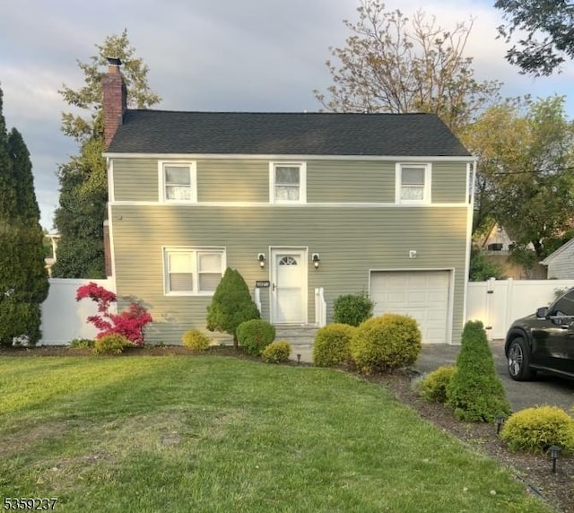 1071 Rose St, Plainfield City, NJ 07060 - view of front of property featuring a chimney, a garage, and driveway