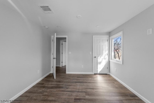 1071 Rose St, Plainfield City, NJ 07060 - unfurnished bedroom featuring dark wood-style flooring and baseboards