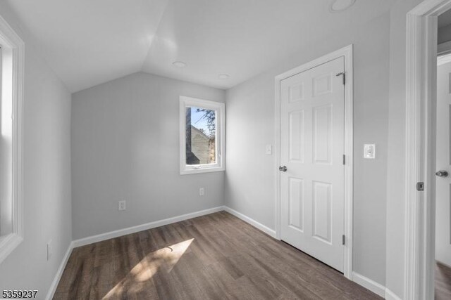 1071 Rose St, Plainfield City, NJ 07060 - unfurnished bedroom featuring wood finished floors, vaulted ceiling, and baseboards