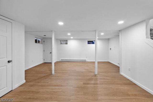 1071 Rose St, Plainfield City, NJ 07060 - finished basement featuring a baseboard radiator, baseboards, light wood finished floors, and recessed lighting