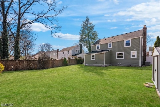 1071 Rose St, Plainfield City, NJ 07060 - rear view of house with a chimney, central AC unit, and a residential view