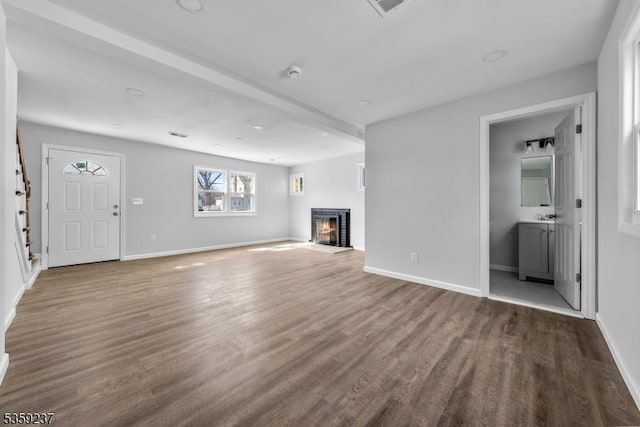 1071 Rose St, Plainfield City, NJ 07060 - unfurnished living room featuring a glass covered fireplace, wood finished floors, and baseboards
