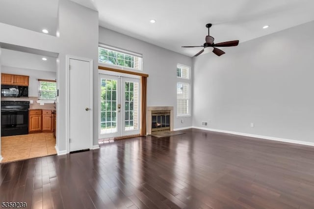 376 Finch Ln, Bedminster Twp, NJ 07921 - unfurnished living room featuring ceiling fan, wood finished floors, a premium fireplace, french doors, and baseboards