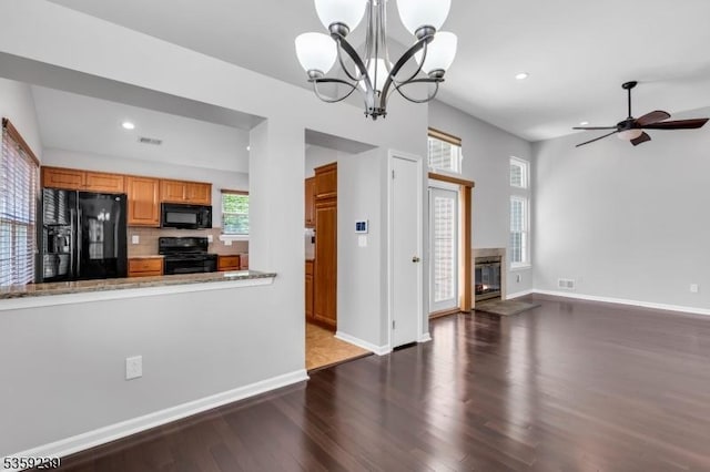 376 Finch Ln, Bedminster Twp, NJ 07921 - kitchen featuring black appliances, wood finished floors, recessed lighting, a glass covered fireplace, and baseboards