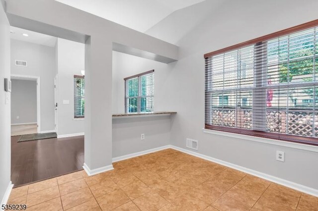 376 Finch Ln, Bedminster Twp, NJ 07921 - tiled empty room featuring lofted ceiling and baseboards