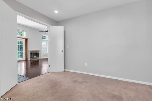 376 Finch Ln, Bedminster Twp, NJ 07921 - carpeted empty room featuring a ceiling fan, a glass covered fireplace, baseboards, and recessed lighting