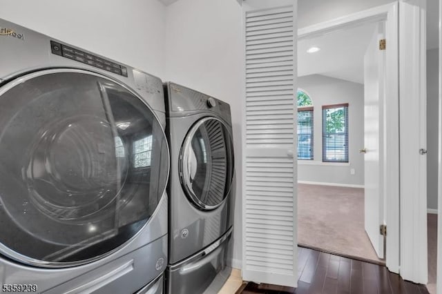 376 Finch Ln, Bedminster Twp, NJ 07921 - laundry area with washing machine and clothes dryer, baseboards, and wood finished floors
