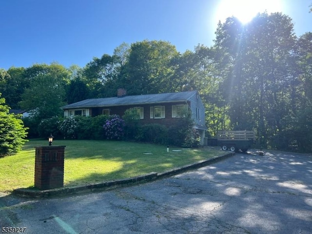 13 E Elro Dr, Jefferson Twp, NJ 07438 - view of front of home featuring a front lawn and a chimney