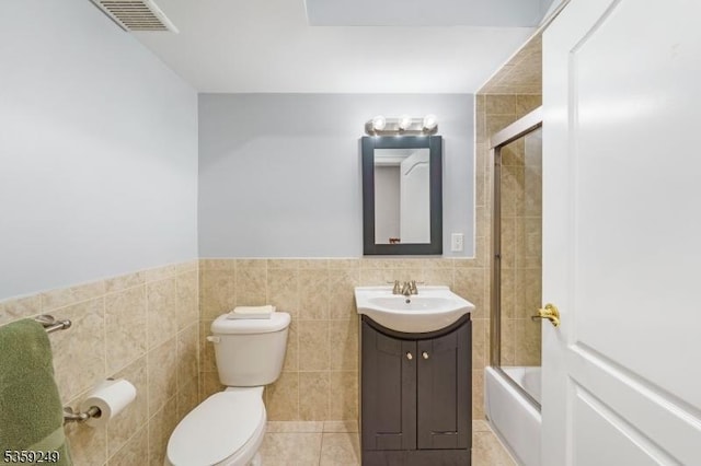 29 E Price St Unit 2, Linden City, NJ 07036 - full bathroom with toilet, vanity, tile walls, combined bath / shower with glass door, and wainscoting
