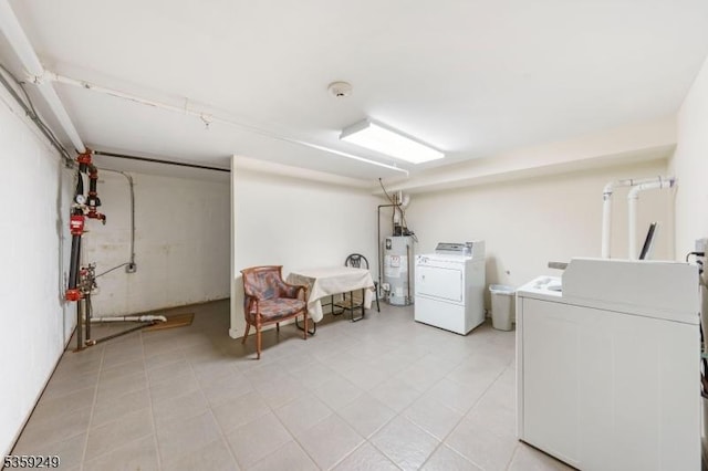 29 E Price St Unit 2, Linden City, NJ 07036 - laundry room with gas water heater, washing machine and clothes dryer, and light tile patterned floors