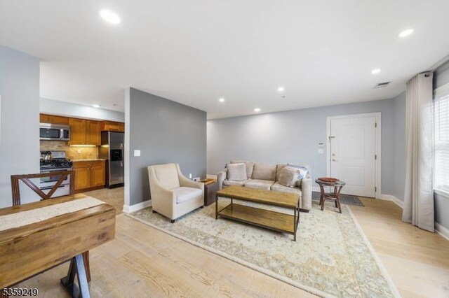 29 E Price St Unit 2, Linden City, NJ 07036 - living room with recessed lighting, light wood finished floors, and baseboards